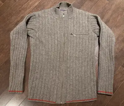 Sweater is overall in great condition. It does have slight wear throughout and an older tear in the...