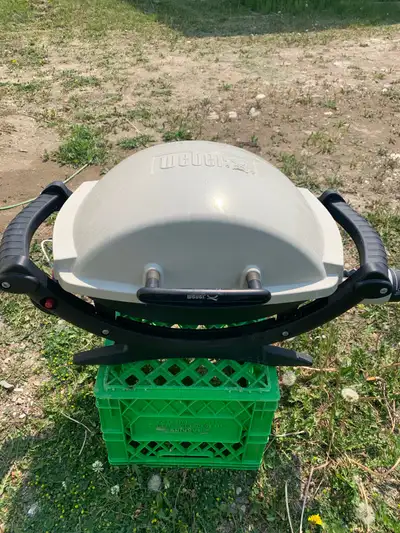 Weber Q-100 portable BBQ. Great for camping. Comes with nifty cover. Takes small green bottles. Need...