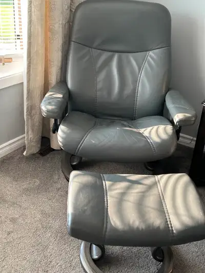 Stressless Leather Chair and footstool in Grey., View more