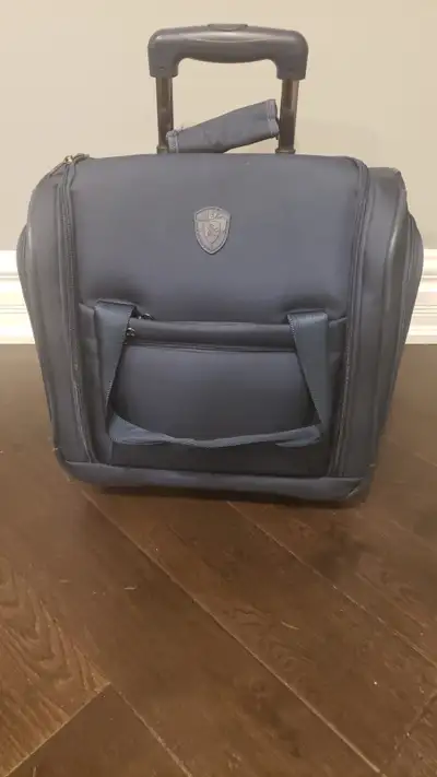 We are selling Heys Carry On Suitcase that can be placed under your seat or on top bin. It is in min...