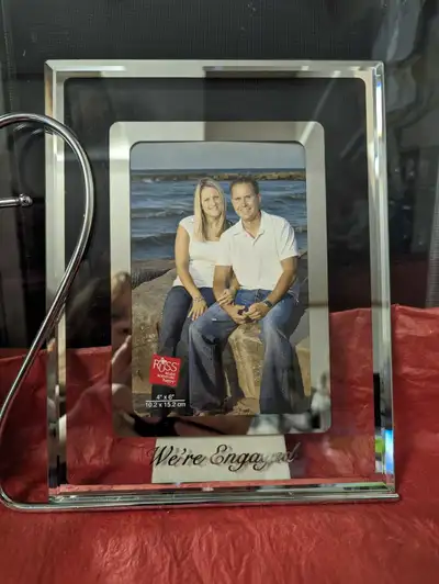 New 7 in  X 9 in frame "We're Engaged"  the picture is 4 x 6, View more