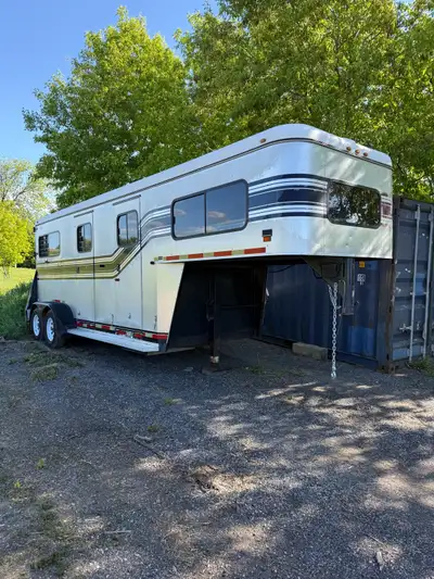 2 horse straight load gooseneck trailer with ramp and large dressing room. Steel frame aluminum body...