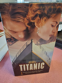 Original 2 Part VHS Titanic tapes, un-opened and Titanic Poster.