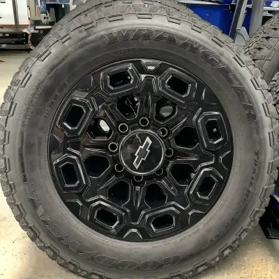 8 Bolt 20” Oem Chevy HD midnight Honey combs Tires are in great condition Goodyear wrangler Trail Ru...