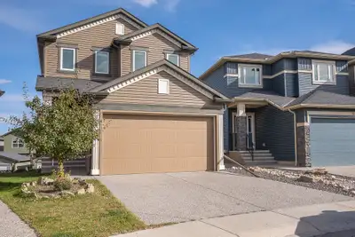 Welcome home to 47 Evanscrest Way NW in the heart of family-friendly Evanston — the kind of place wh...