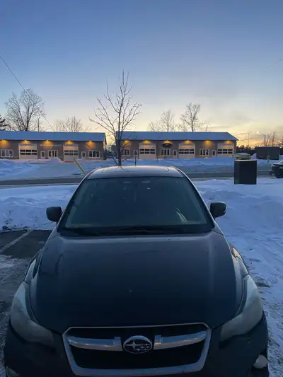 2014 IMPREZA with 205,000 km, replaced transmission with 149000 km on it. New exhaust system. Winter...