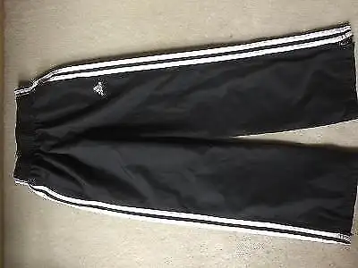 Water resistant ADIDAS pant. zippered bottom can be worn over boots/skates