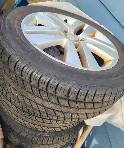 Two sets of tires on rims, One set is 16 " mud and snow 5x110mm rims other is 17" studded on Chevrol...
