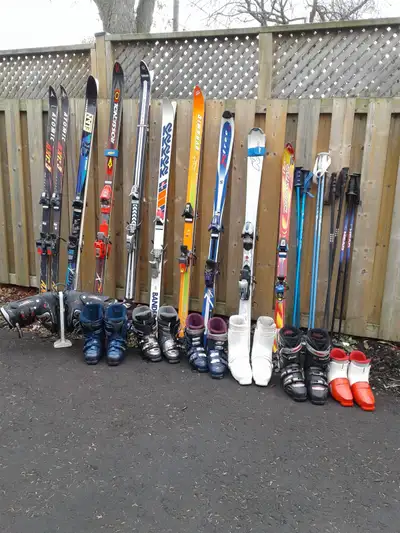 ASSORTED USED DOWNHILL SKIS AND BOOTS, View more