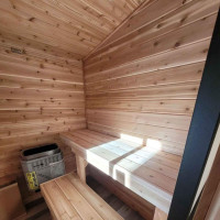 Outdoor sauna with electric heater