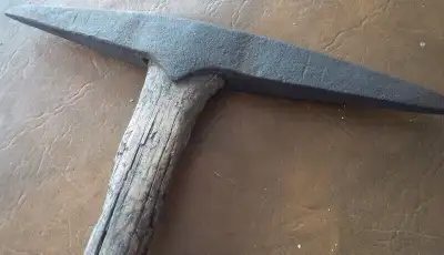 Axe blade measures approx. 15" wide; total length is approx. 31" The handle is in display condition...