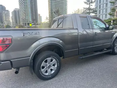 2012 Ford F-150 FX4 5.0 in excellent condition. Bucket seats with sliding back window and step up ta...