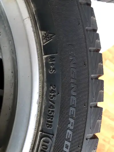 4 winter tires 245/45R18 on Buick OEM rims 5x120 bolt pattern. 2 Ovation tires, 1 Motomaster and 1 M...