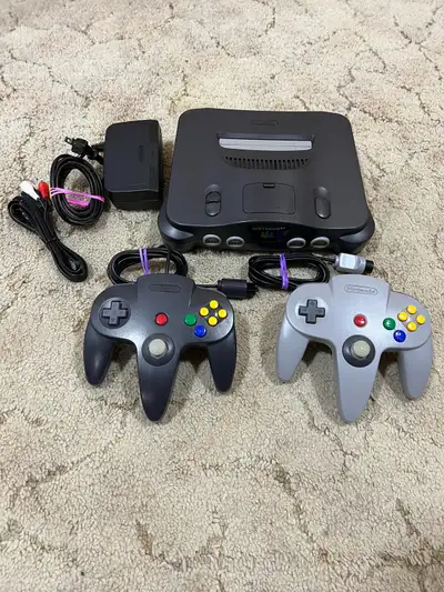 Cleaned and tested, this N64 comes with 2 authentic Nintendo controllers with new joysticks installe...