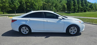 Selling my 2012 Hyundai Sonata, white exterior, automatic, with approximately 257,000 km. This has b...