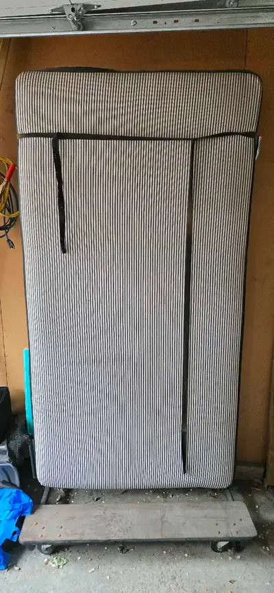 Twin bed frame, wheeled when upright. Free for pick up only in Highland Park