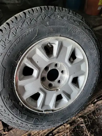 As Pictured. Decent tread, all hold air. No center caps.