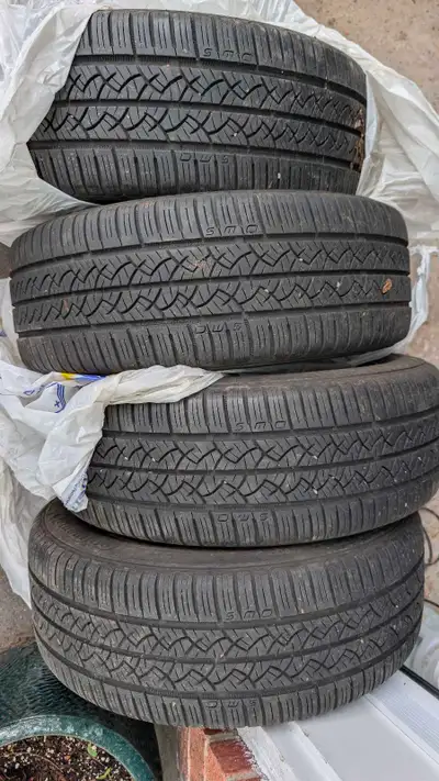 Nearly new all season tires on alloy rims 205/55 R16