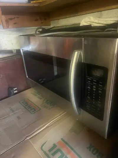 I'm selling a used Samsung stainless steel over-the-range microwave and electric range, both with sl...