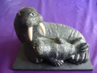 INDIGENOUS SCULPTURE - MAMA WALRUS AND BABY ON SLATE BASE