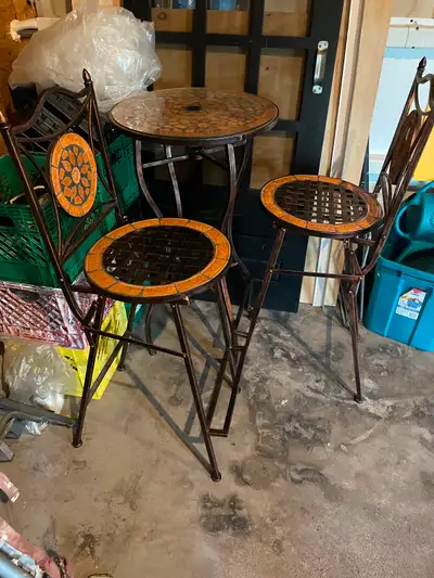 Tall table and two matching chairs in excellent condition. Tiled seats backs and table top. Asking $...