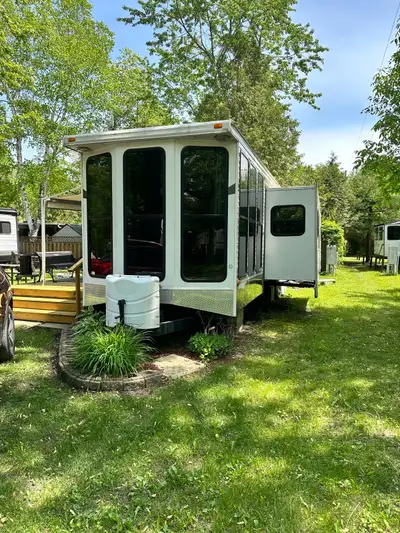 Trailer for sale 2011 Palomino Puma Park model trailer in condition. Two tip outs, one bedroom, 2 si...