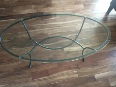 Lovely coffee table for sale. Heavy glass top without damage. Dimensions: 49 inches by 25 inches. St...