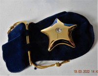 Wishing Star gold talisman with Austrian Crystal in jewelry bag