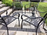 4 Aluminum outdoor chairs in black.