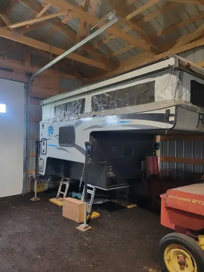 Are you looking for a back country adventure this Real lite popup Truck camper is for you. We purcha...