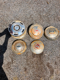 Old vintage Chevy hub caps