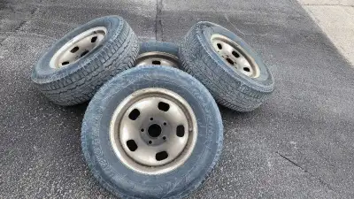 Selling a set of four winter tires mounted on 17-inch rims, size 265/70R17, originally from a Ram 15...