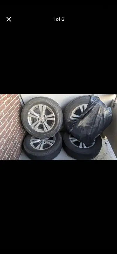 OEM Chevy Equinox rims with all-season tires (size 225/65R17). Perfect fit for Chevy Equinox (2010–2...
