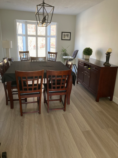Table with eight chairs and hutch.