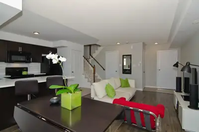 Luxurious Oakville Uptown Core two-story townhouse condo for rent, offering two (2) bedrooms and two...