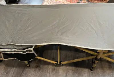 Get ready for your next camping trip with this heavy-duty folding camping cot, designed for adults a...