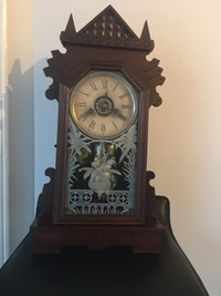 Antique 19 century ansonia alarm mantle clock. 21”tall.