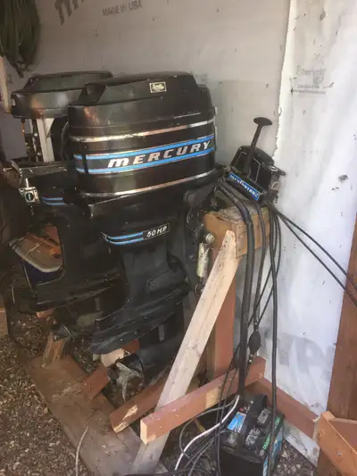 Two 50HP 2 stroke outboard motors. Complete with cables, controls and fuel tank. One runs and is in...