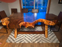 Solid unique live edge dining room table.