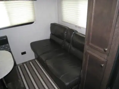 Double bed at front with a TV, sink, toilet, shower (never used) Hot water tank, AC and Furnace both...