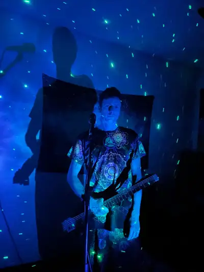 Looking for a drummer and bassist for an alien rock band , View more