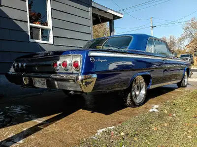 Here ws have a 1962 Impala with a 327 linked up to a 4 speed manual Muncie trans rockers solid , flo...