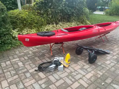 Like new, tandem kayak. Comes with everything in the photos including: 2 paddles, portage wheels, la...