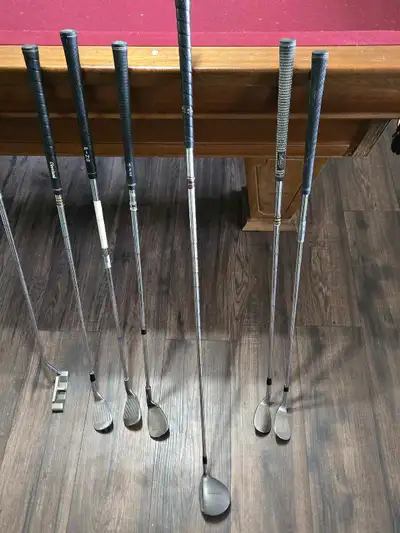 Various golf clubs, wedges, putter, 3 wood., View more