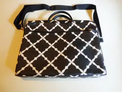 15 1/2 IN .WIDE , X 11 IN. HIGH , WITH A ZIPPERED POUCH ON FRONT, AND A OPEN POUCH ON THE BACK , WIT...