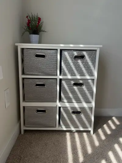 Add stylish storage to any room with this cabinet, featuring six woven basket drawers. The unit is i...