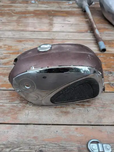 Old Honda gas tank forms 60's. One dent left side. Old rusty dented good for garage art