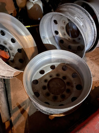 Four 24.5" aluminum unimount wheels 