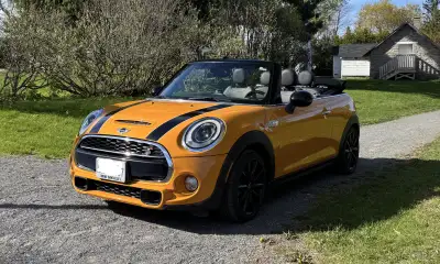 A joy to drive this 6 speed Sport Version Mini Cooper Convertible - and with the Volcanic Orange col...