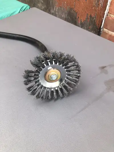 Ryobi trimmer head with wire brush head ! Great for removing rust or weeds from interlocks . Wire he...